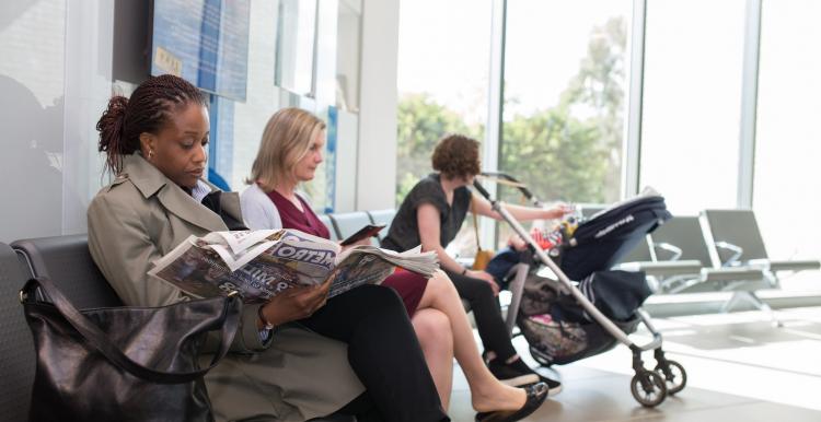 people waiting in a gp surgery