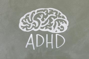 chalk drawing of a brain and the letters A D H D