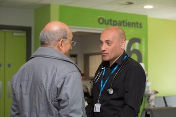 doctor talking to patient in hospital 