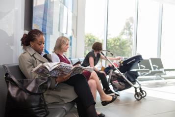 people waiting in a gp surgery